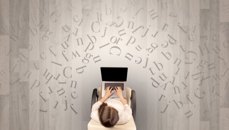 Letters with woman using laptop in a chair